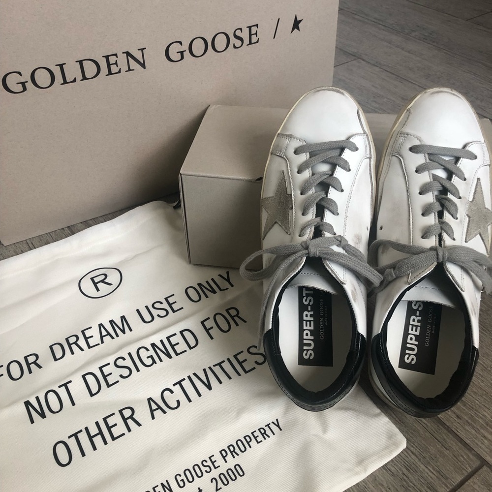 Women’s Super-Star sneakers with black heel tab and metal stud lettering…